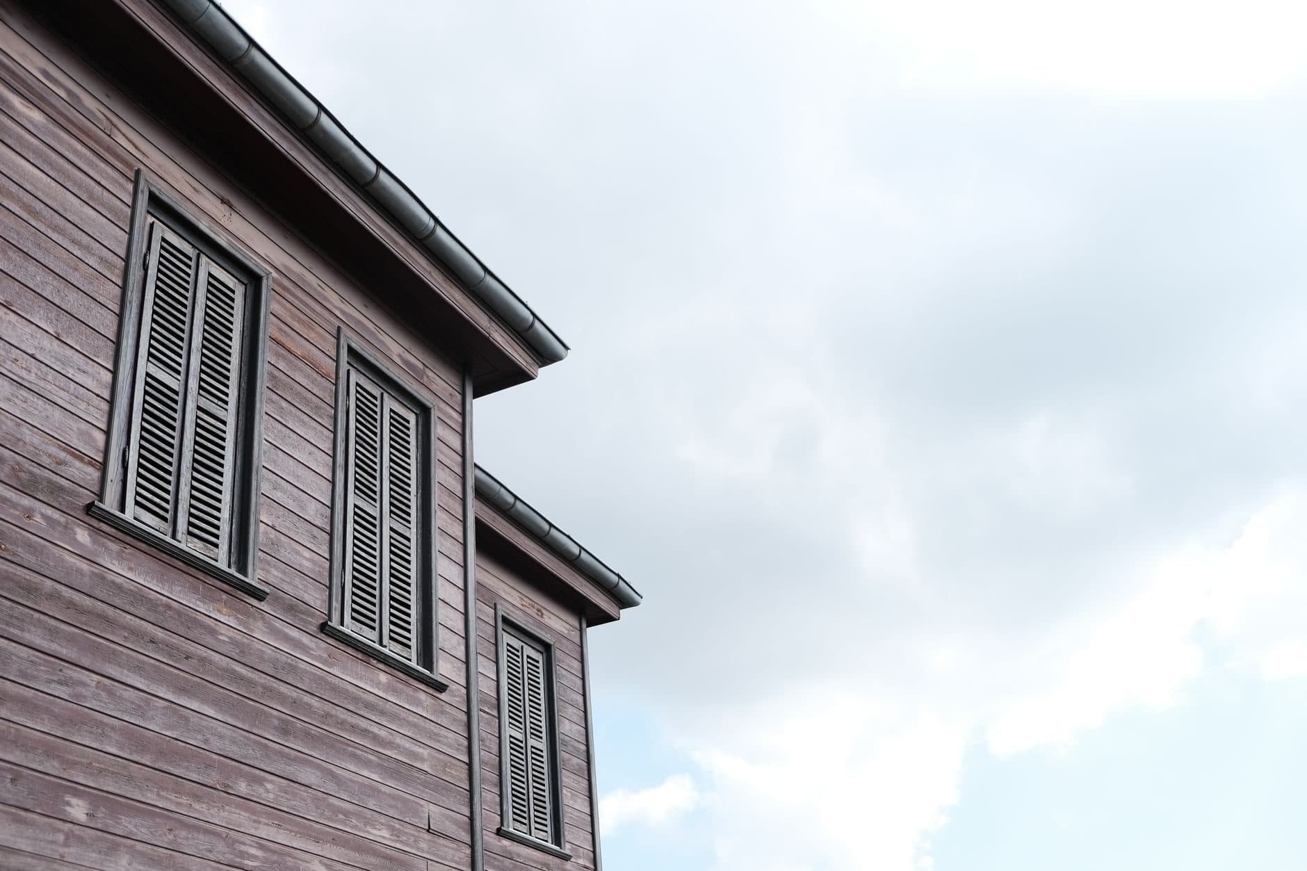 The underside of a roof overhang against open sky