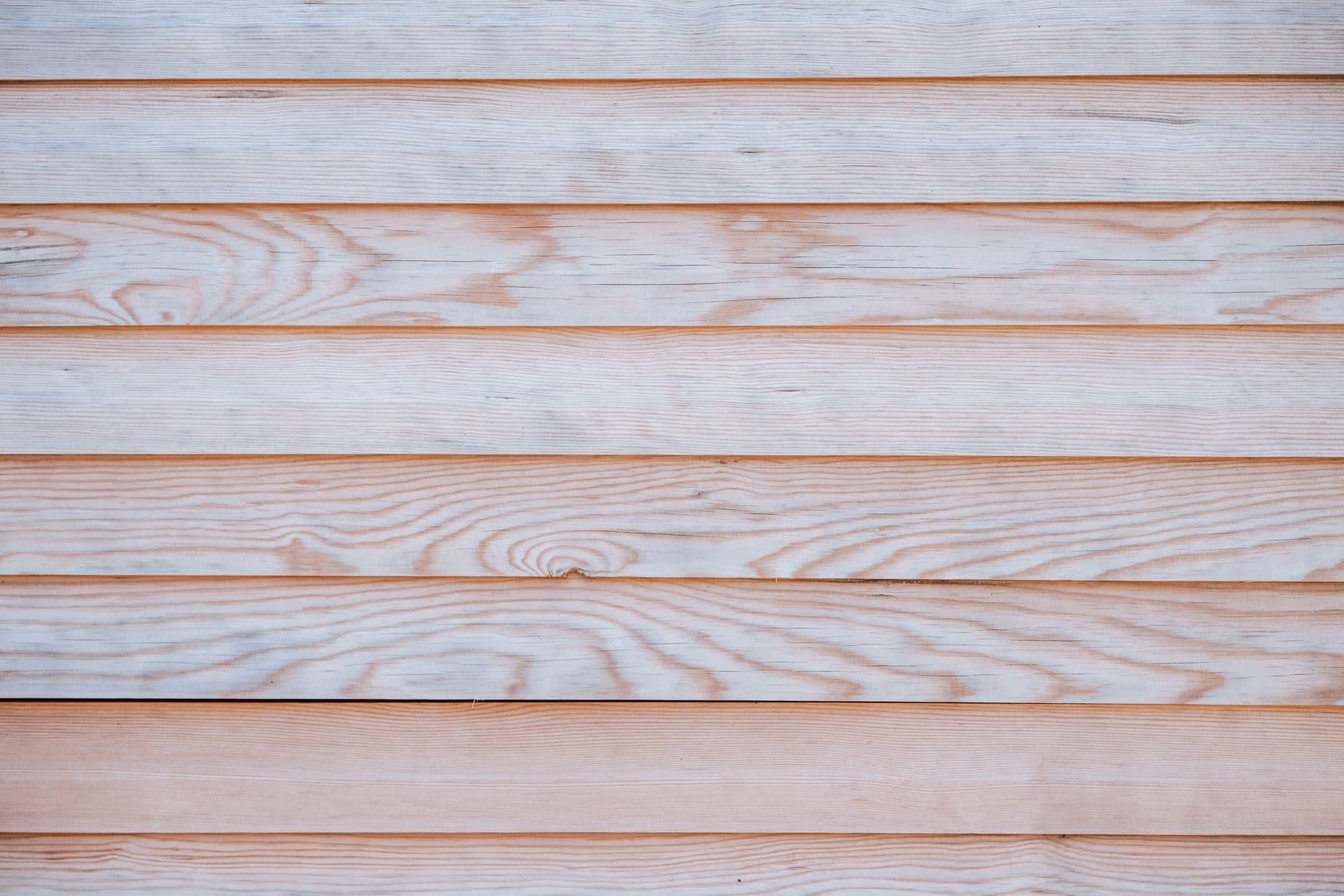 Lap siding running clean across a house wall